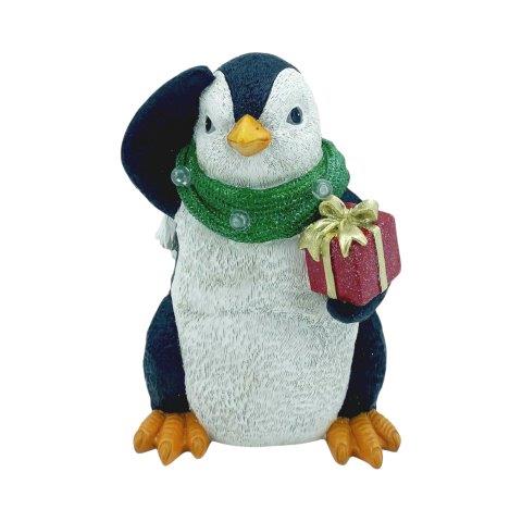 Christmas Penguin figurine wearing a green scarf with a red present.