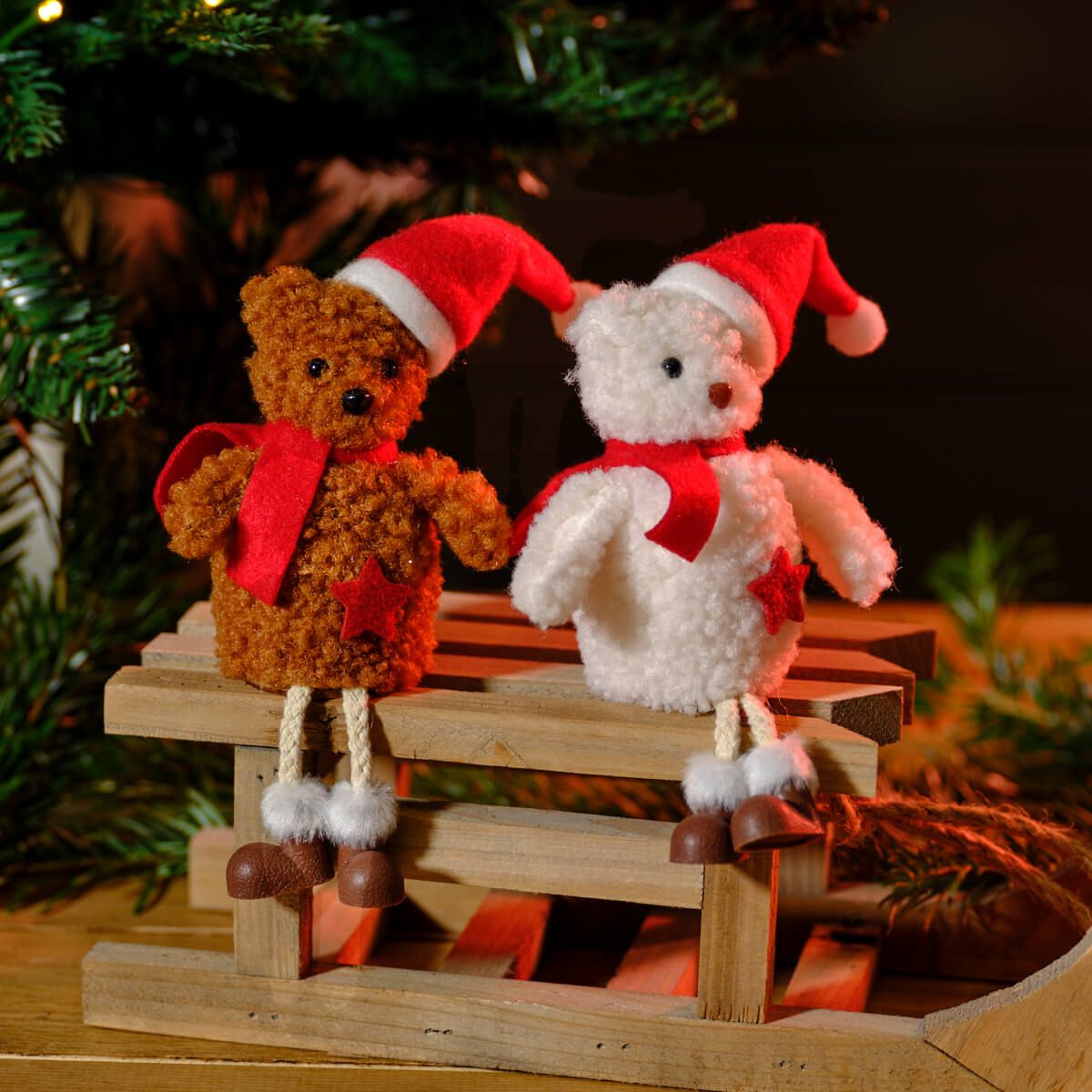 Set of 2 assorted shelf sitter teddy decorations made of plush material in white and brown colors, each wearing red Santa hats, red scarves, and brown shoes with white trim, featuring star accents on their bodies.
Skip to the end of the images gallery
Skip to the beginning of the images gallery
Details
