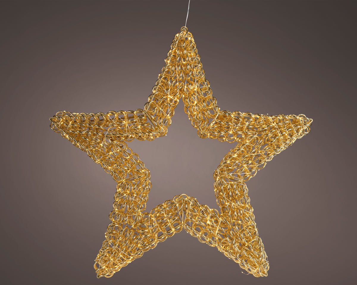 A golden metallic star-shaped hanging ornament with a textured, woven chain-like pattern, shown against a dark brown gradient background.