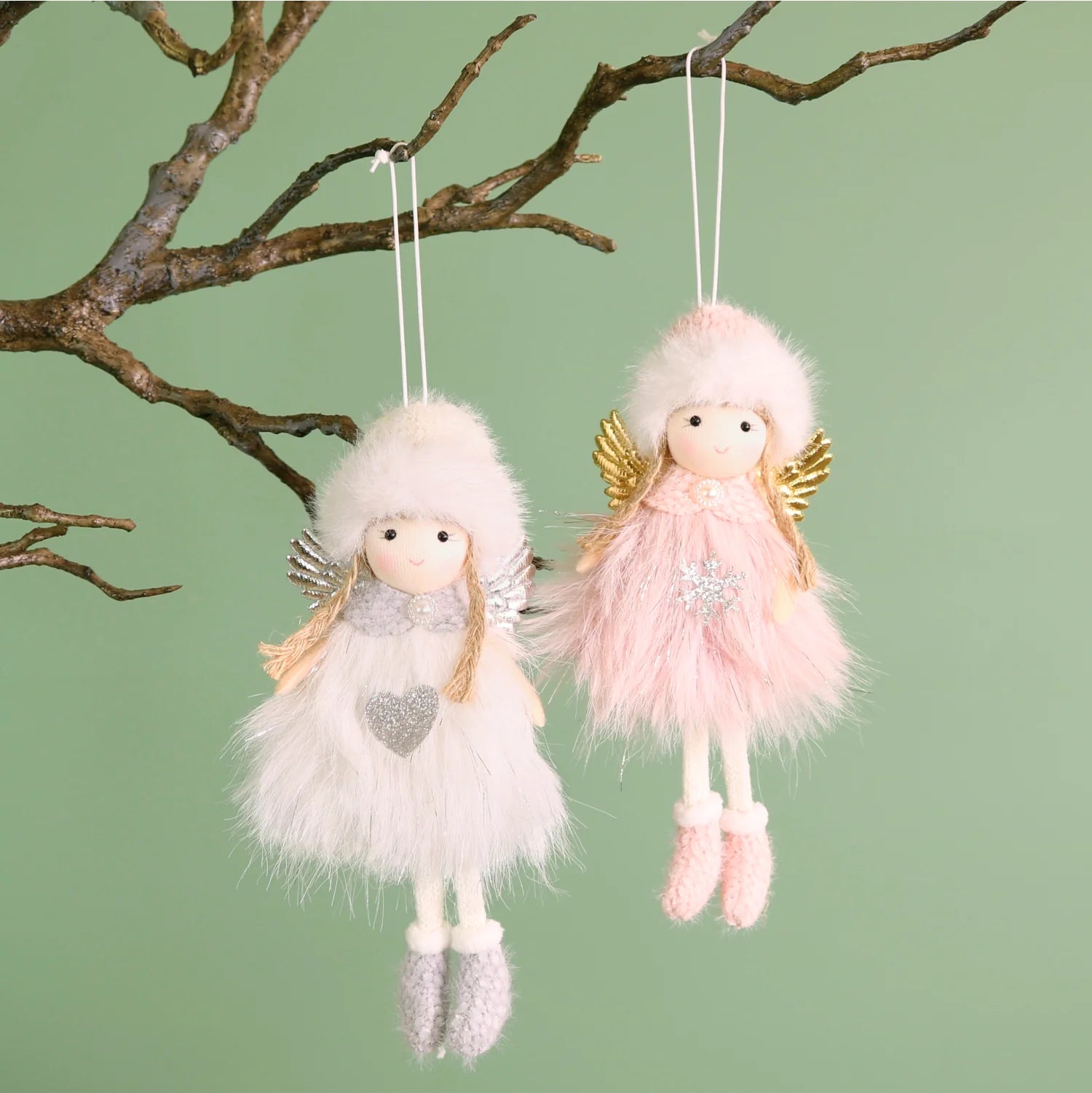 Dewdrop and Lark angels in white and silver and pink in gold in fur dress and hat
